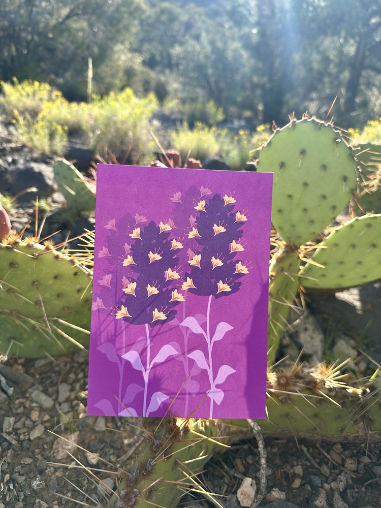 purple wildflowers art print by MidSun Designs. Art print outside by a cactus.